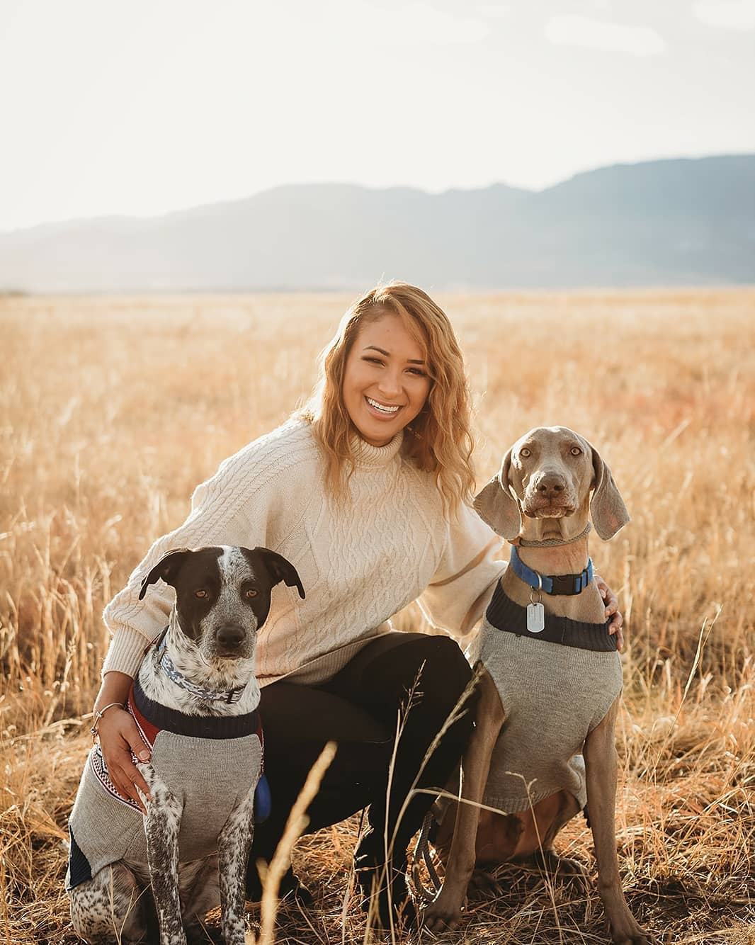 Merly with two dogs in a Colorado field